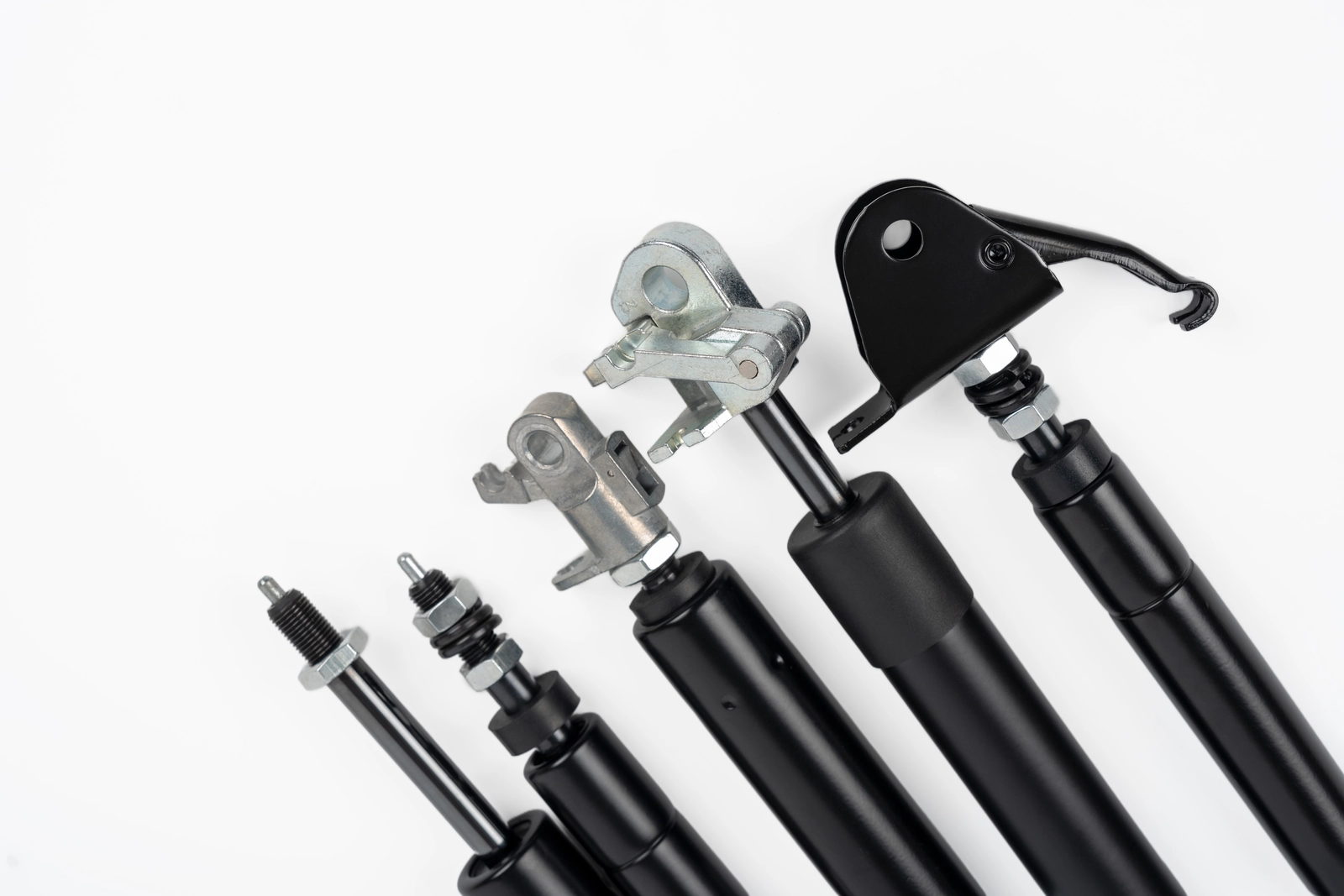 Assortment of Newton lockable gas springs, compression gas struts, and end fittings