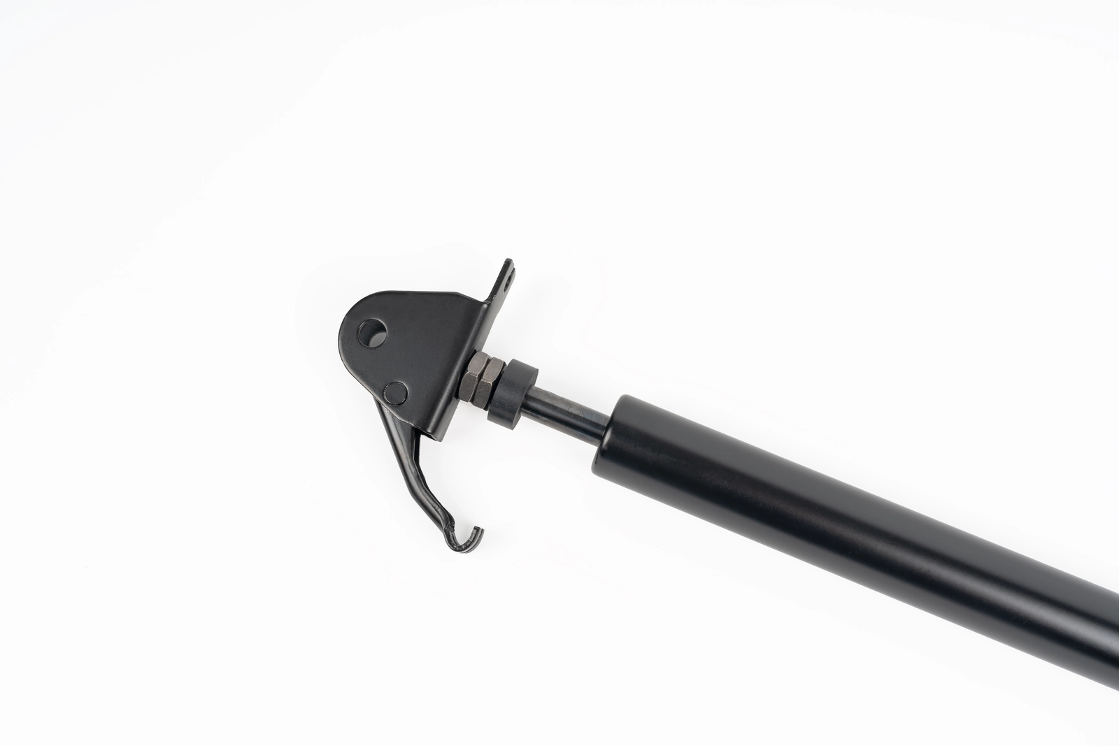 Close-up of medical bed locking gas spring release pin and threaded fitting